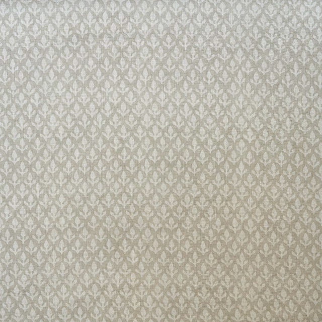 Pale stone taupe fabric with a small repeating leafy ogee motif and textured weave