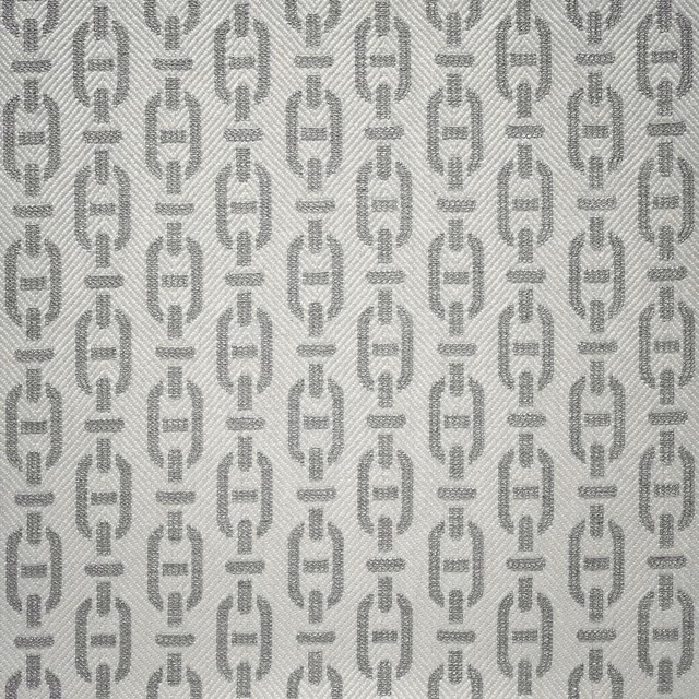 Cloud-grey textile with repeating elongated geometric motifs and fine diagonal weave.