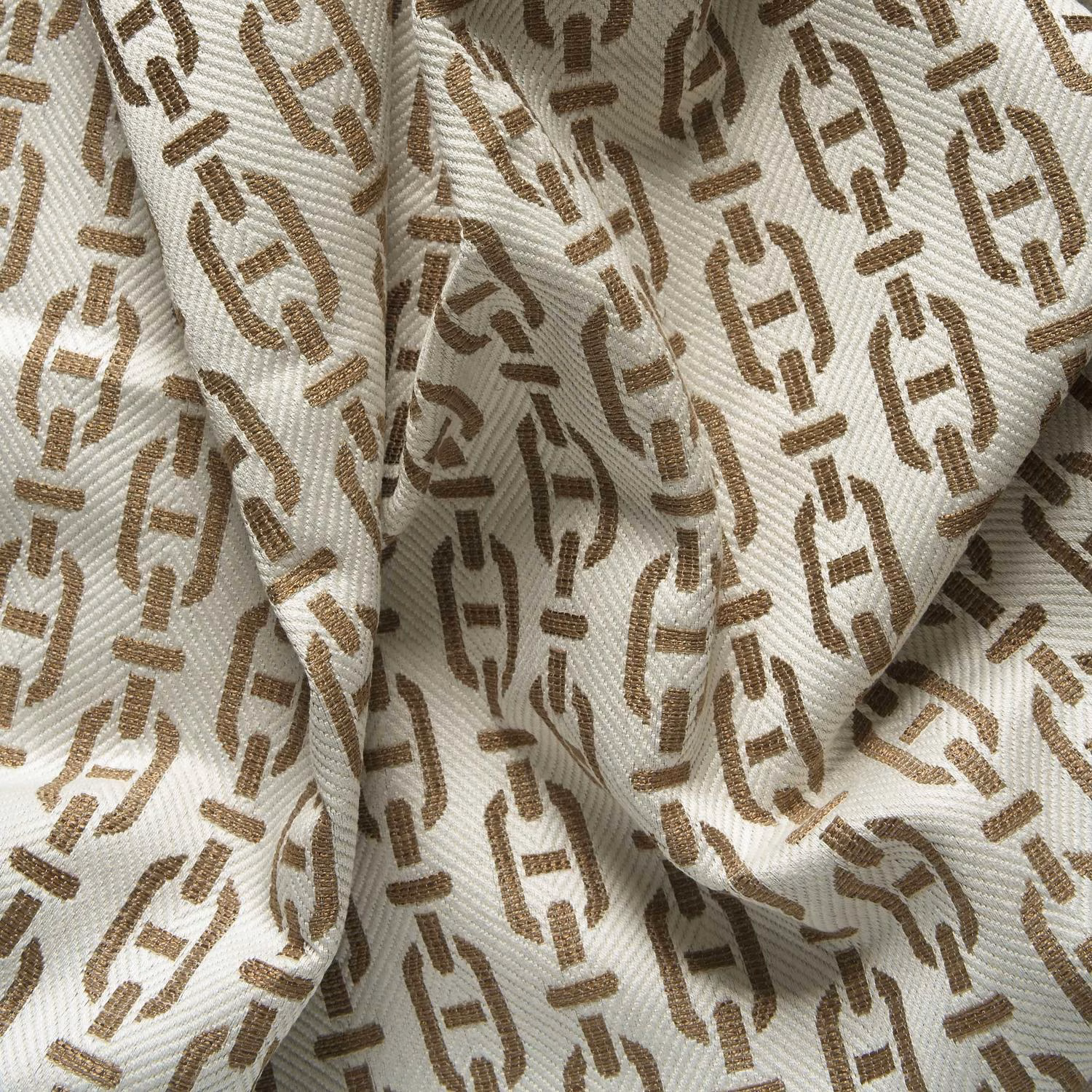 Cream ribbed weave with warm tan and brown broken geometric motifs