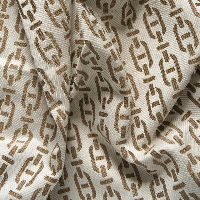 Cream ribbed weave with warm tan and brown broken geometric motifs