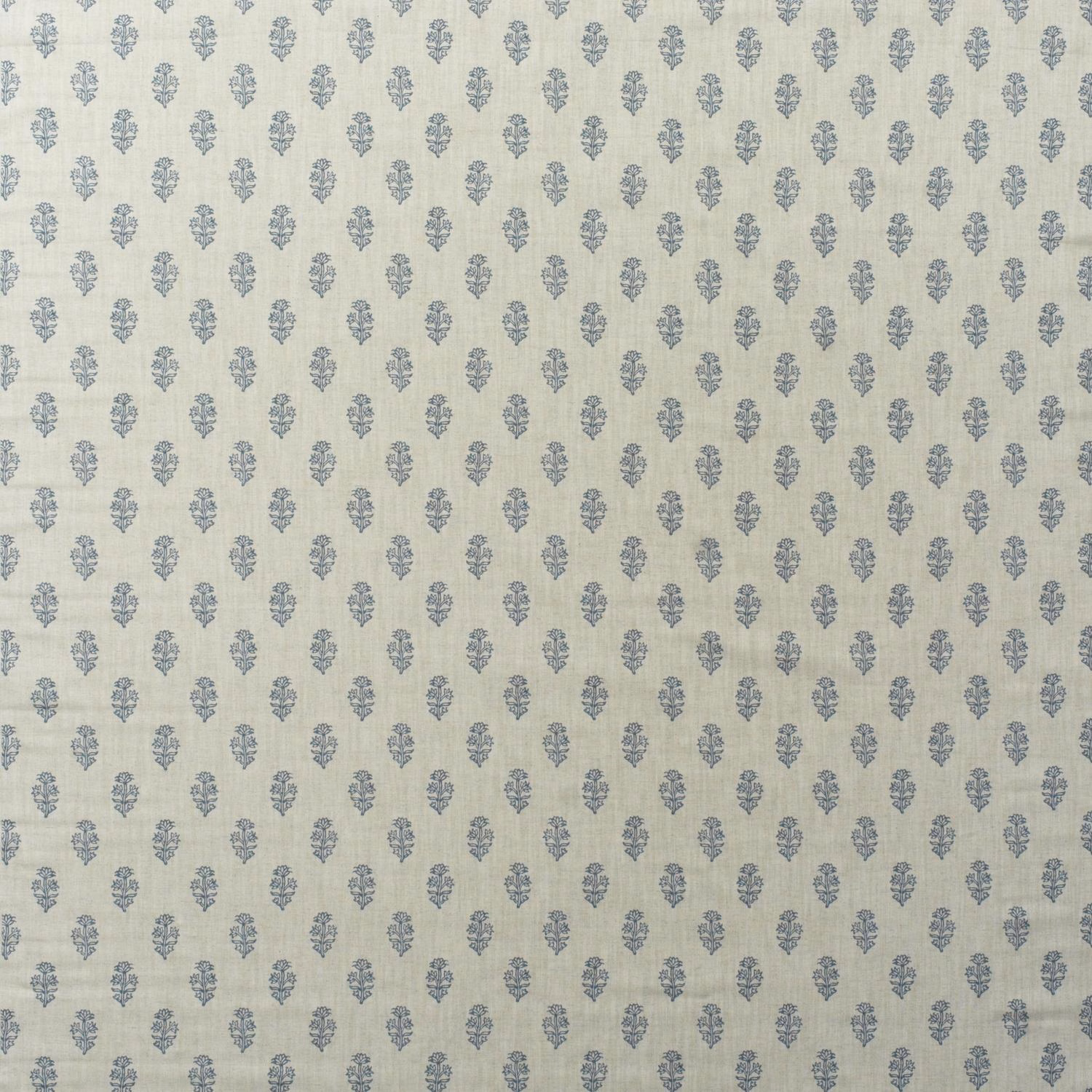 Pale cream cotton print with evenly spaced dusty denim-blue floral motifs