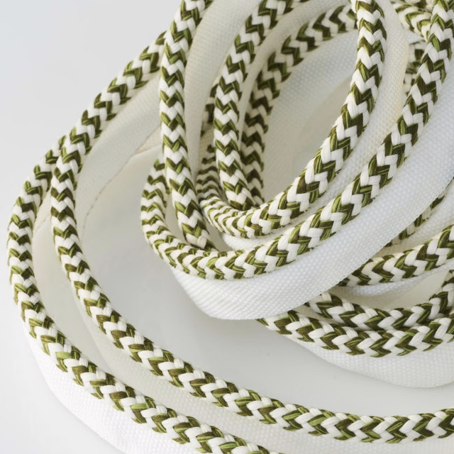 White outdoor trim with olive-green chevron braid and raised corded texture