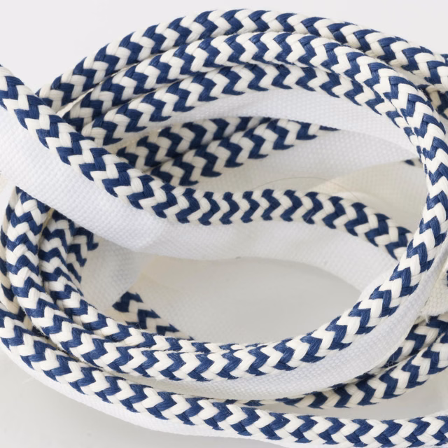 Navy and white braided chevron trim shown in overlapping textured loops