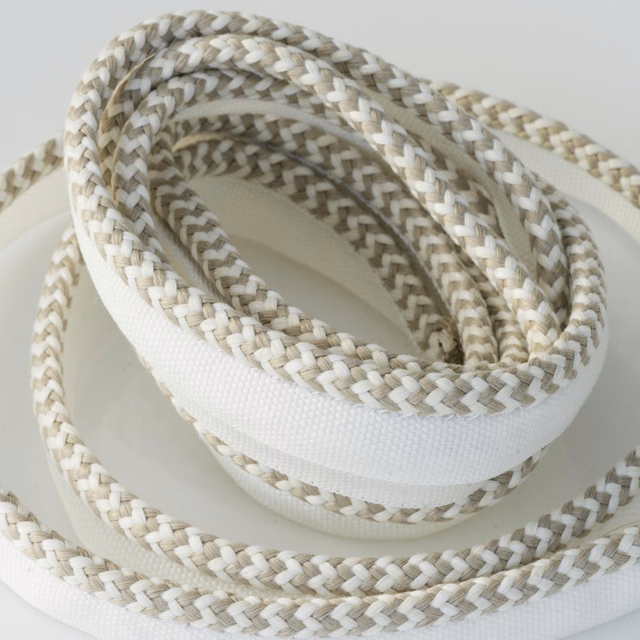 Coiled sand and cream braided outdoor trim with a broad white central band