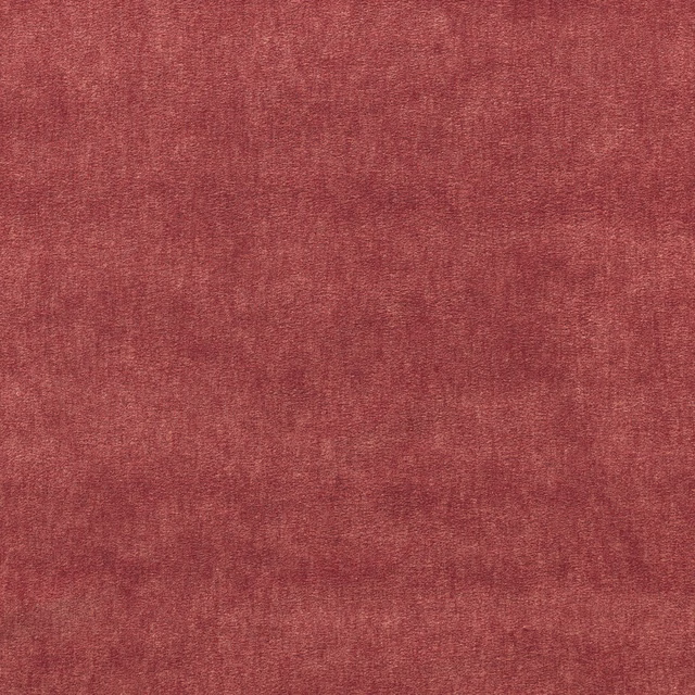 Deep rouge red velvet with a fine mottled nap and soft tonal depth