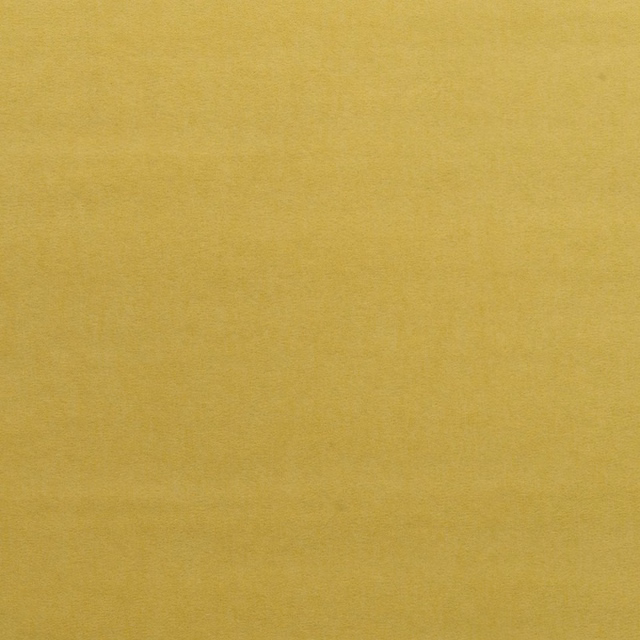 Close-up of mustard-gold velvet with a softly brushed, subtly shaded surface