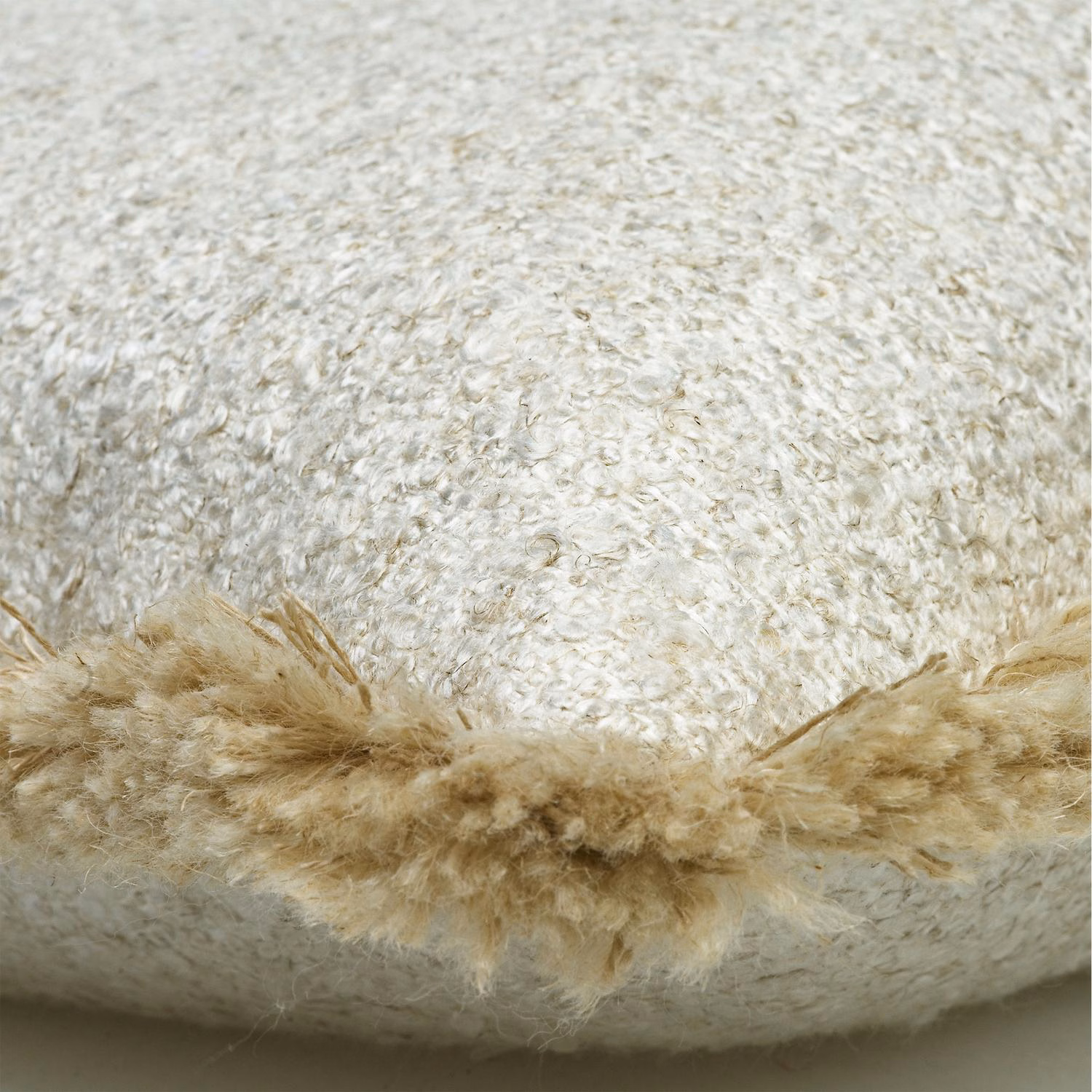 Ivory textured fabric with a broad shaggy warm beige trim