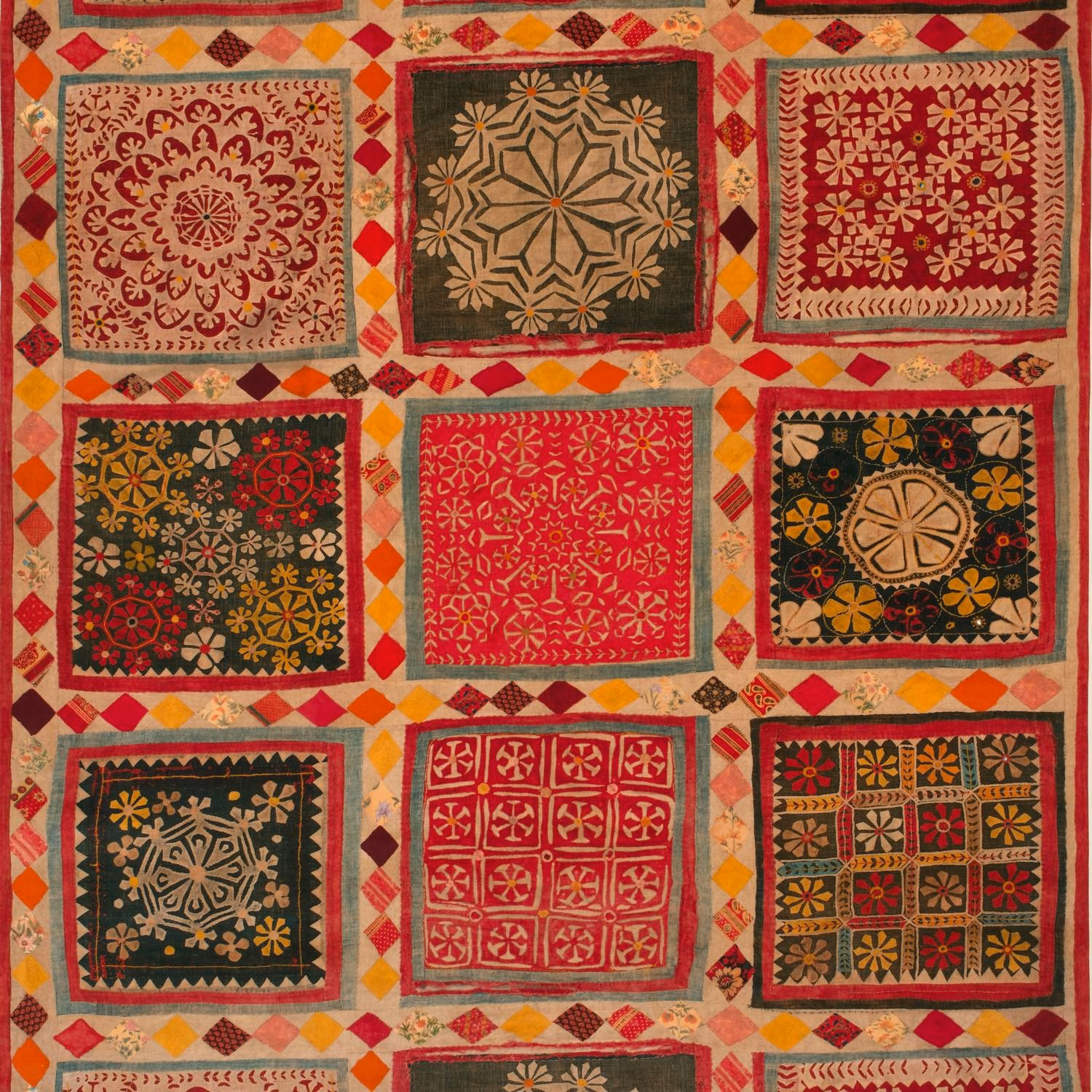 Red, mustard, olive and charcoal velvet with framed floral and geometric square motifs