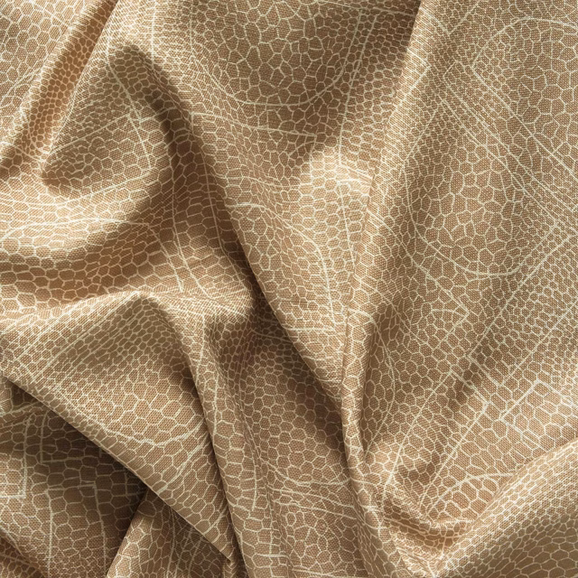 Warm almond fabric with fine pale cellular tracery, softly folded to show subtle sheen