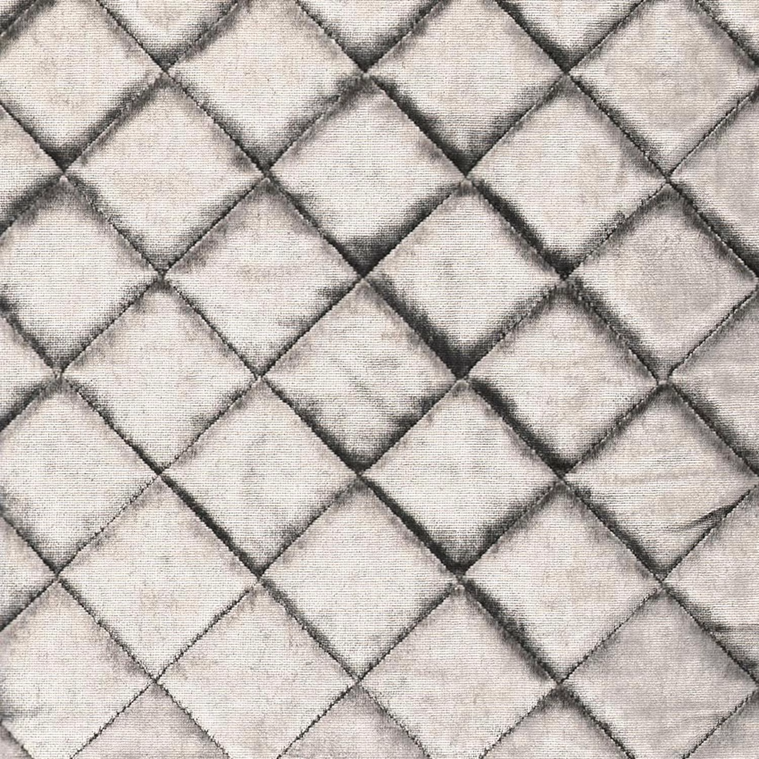 Pale platinum-grey fabric with raised diamond quilting and softly shaded seams