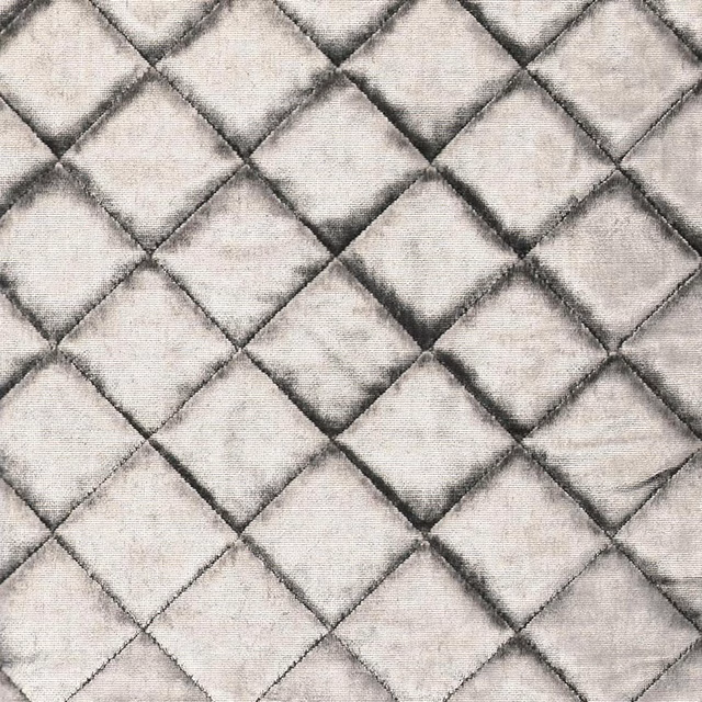 Pale platinum-grey fabric with raised diamond quilting and softly shaded seams