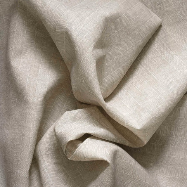 Pale cloud-grey woven textile with fine intersecting lines and softly folded texture