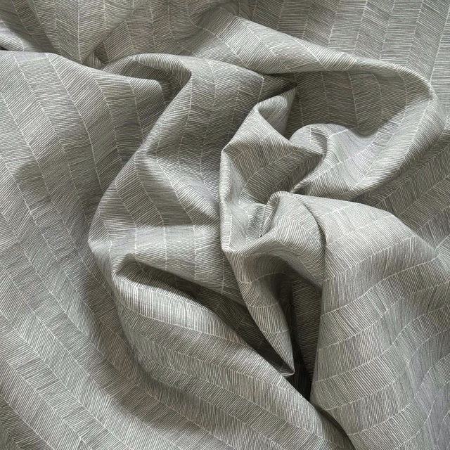 Gathered muted olive-grey outdoor fabric with fine broken linear woven bands
