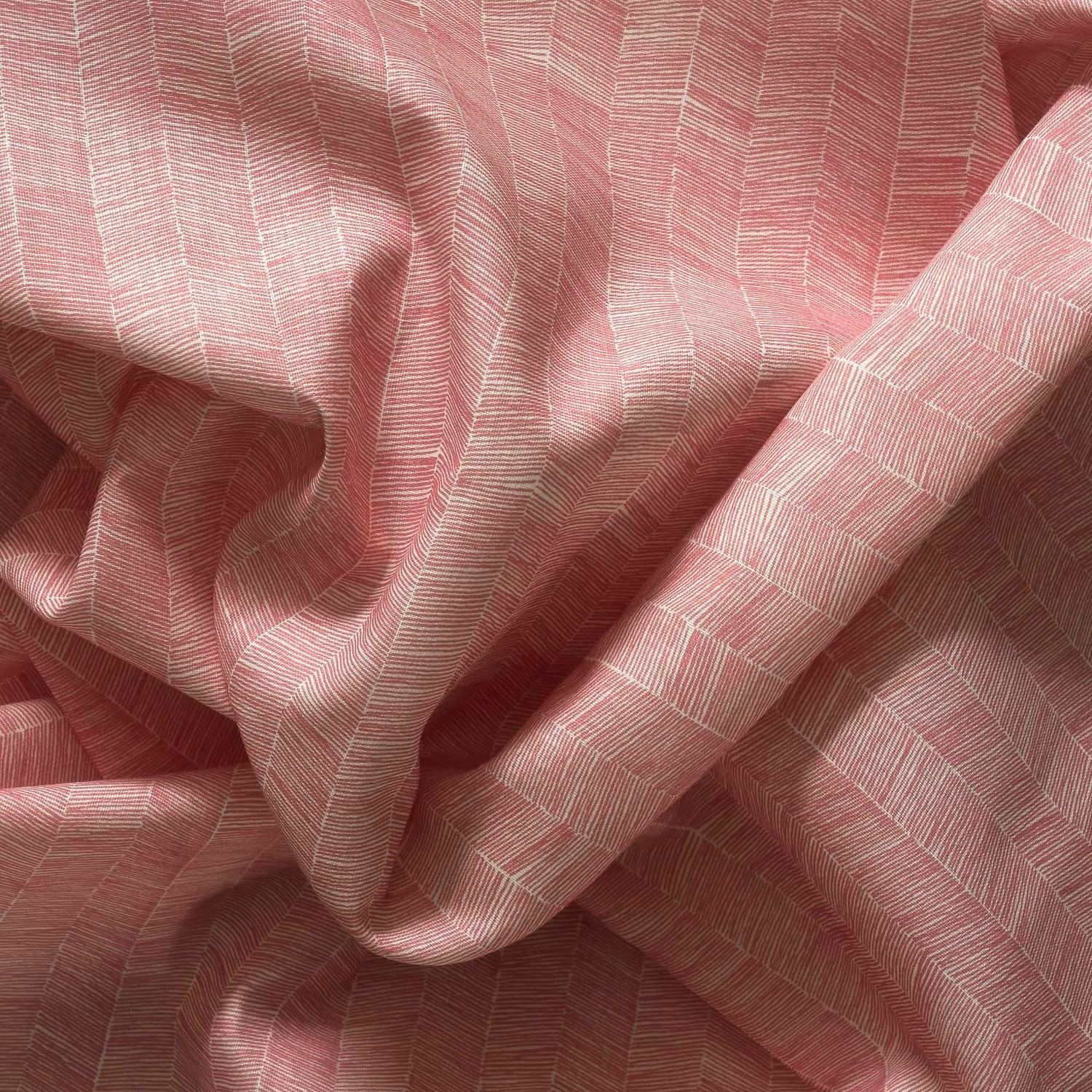 Dusty rose outdoor fabric with fine pale geometric lines and softly textured woven folds