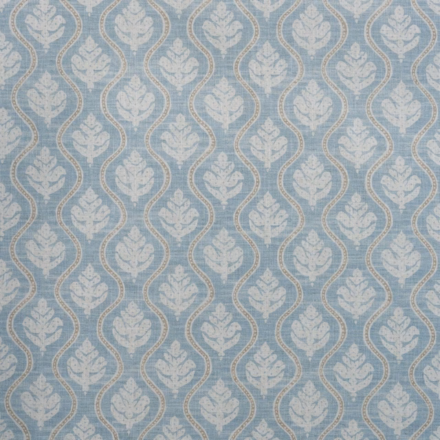 Muted sky-blue fabric with pale floral ogee motifs and a softly textured weave