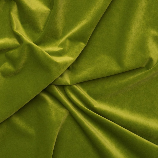 Vivid grass green velvet with luminous folds and plush reflective pile