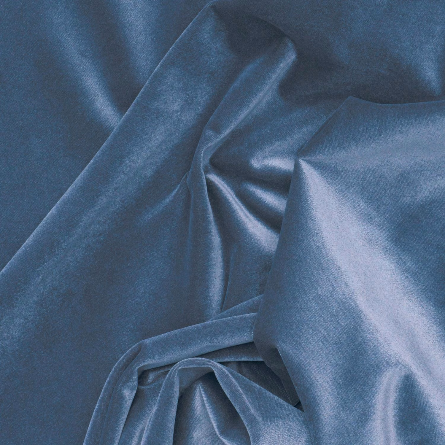 Deep midnight-blue velvet folded into glossy ridges, with cool slate highlights