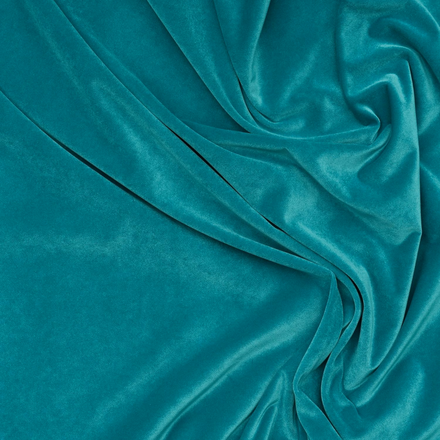 Saturated turquoise teal velvet with luminous sheen across softly gathered folds
