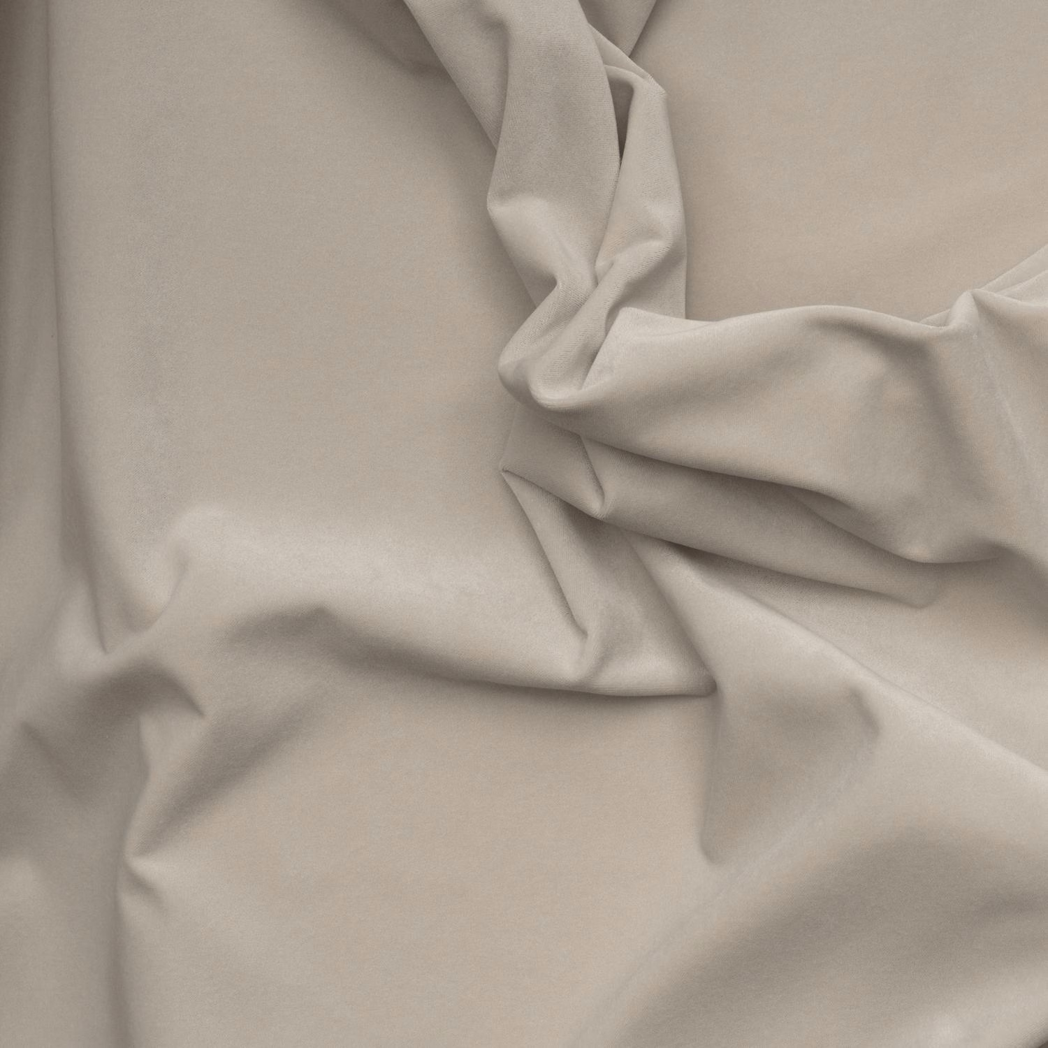 Soft stone taupe outdoor velvet with a smooth nap folded into deep sculptural creases