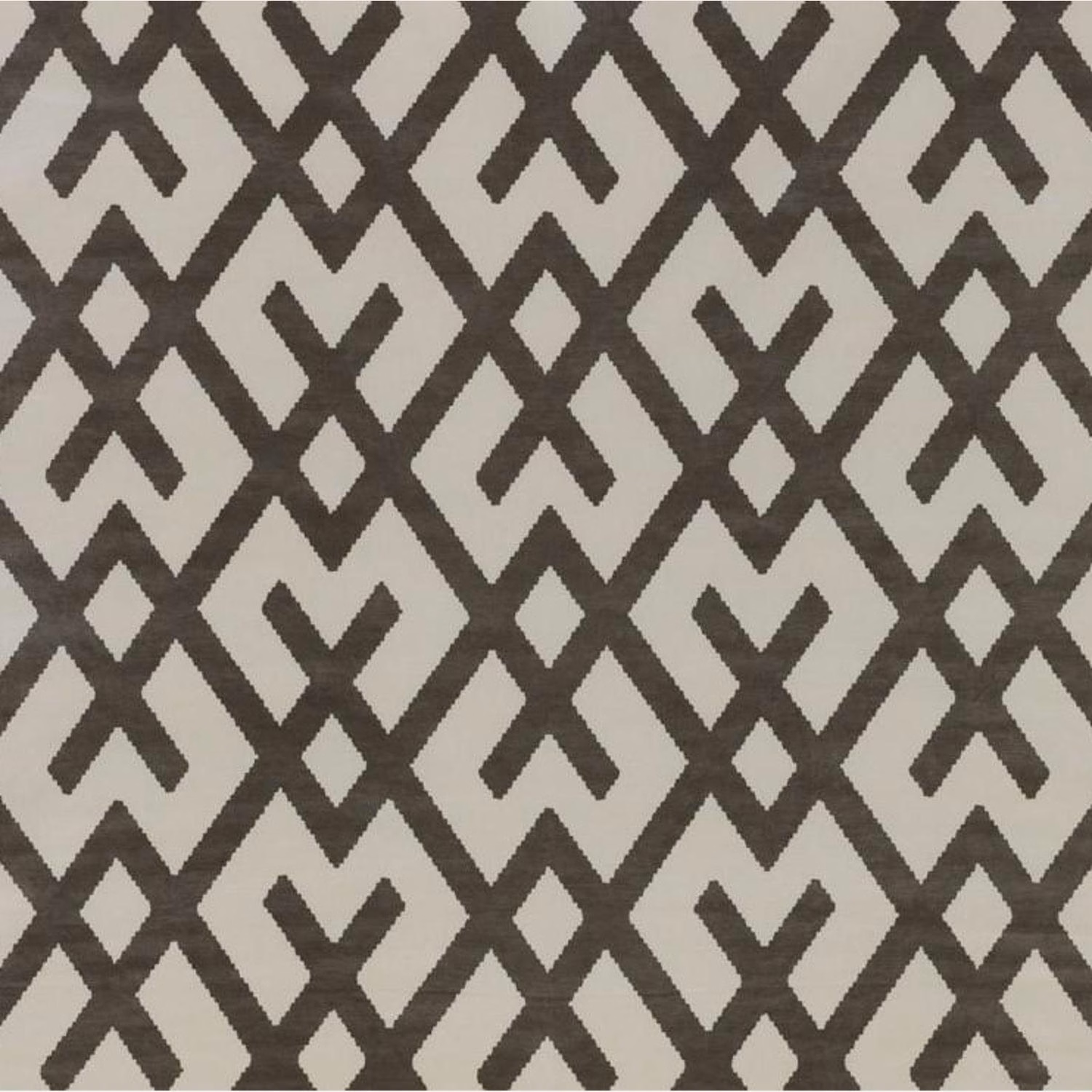 Charcoal-brown angular geometric motifs on a pale stone-grey woven ground