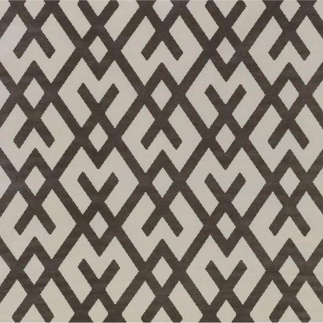 Charcoal-brown angular geometric motifs on a pale stone-grey woven ground