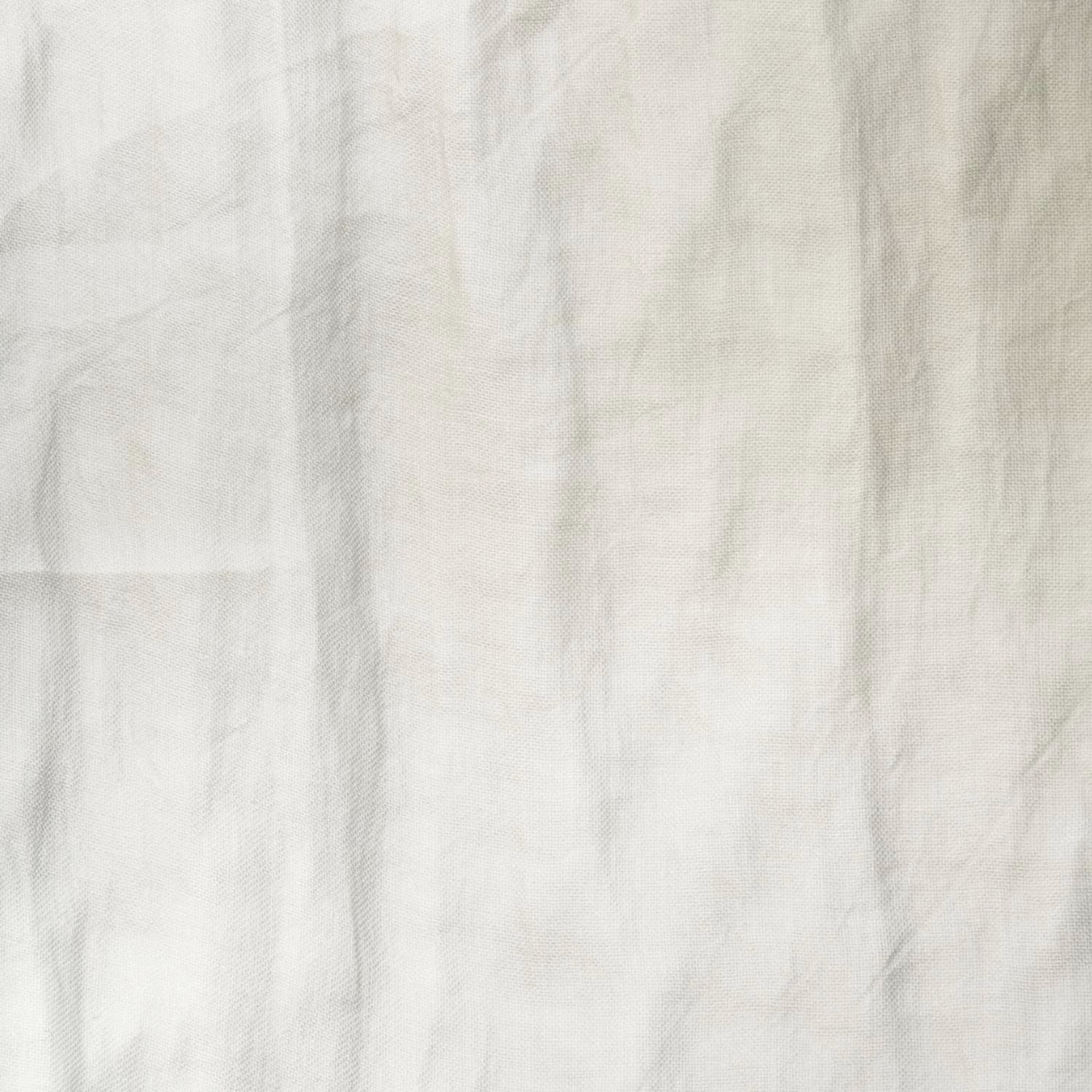 Pale ivory cream textile with crinkled vertical texture and softly translucent tonal variation