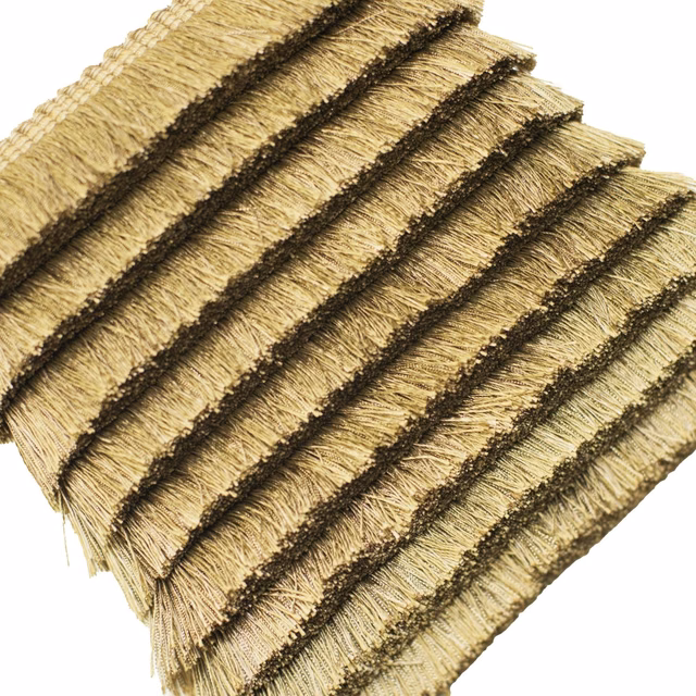 Antique-gold fringed trim with dark raised bands and a tactile ribbed surface