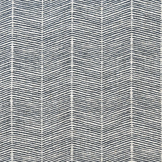 Deep denim blue textile with pale vertical chevron columns and fine woven texture