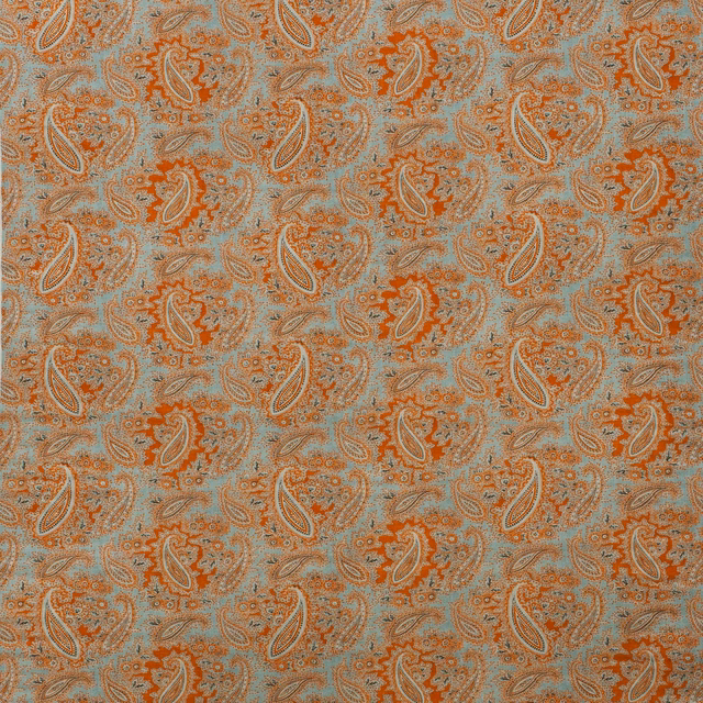 Duck egg blue fabric with rust and cream paisley motifs in a fine textured weave