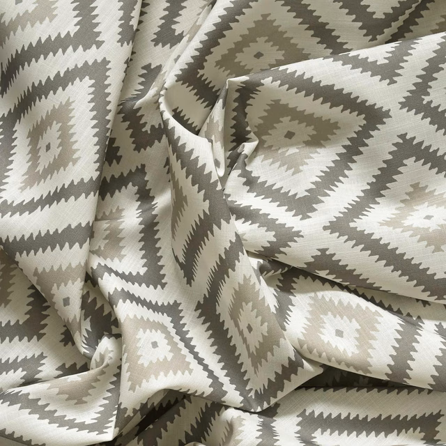 Stone grey outdoor fabric with ivory and taupe geometric diamonds and zigzag borders