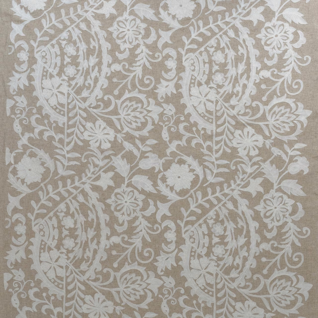 Ivory floral embroidery with curling stems on a warm taupe-grey woven ground