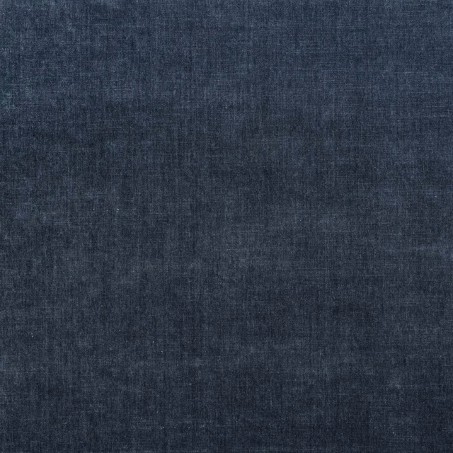 Deep denim-blue chenille with softly mottled charcoal threads and a brushed woven texture
