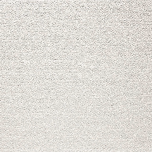 Close-up of warm ivory fabric with a fine, softly nubby surface