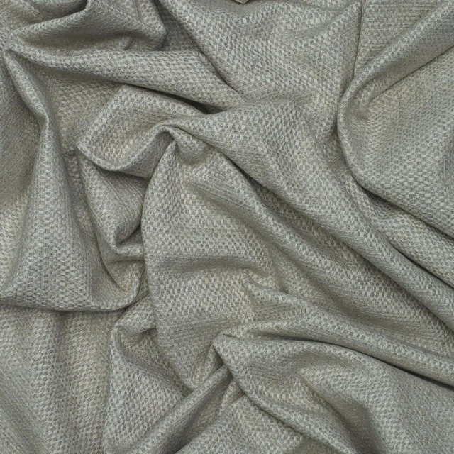 Cool grey woven textile with fine pebbled texture gathered into soft folds