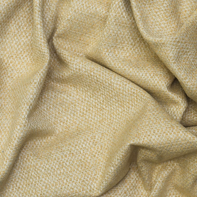 Pale yellow and cream small-scale woven texture gathered into soft folds