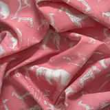 Dusty rose outdoor fabric with pale illustrated animals and softly textured folds