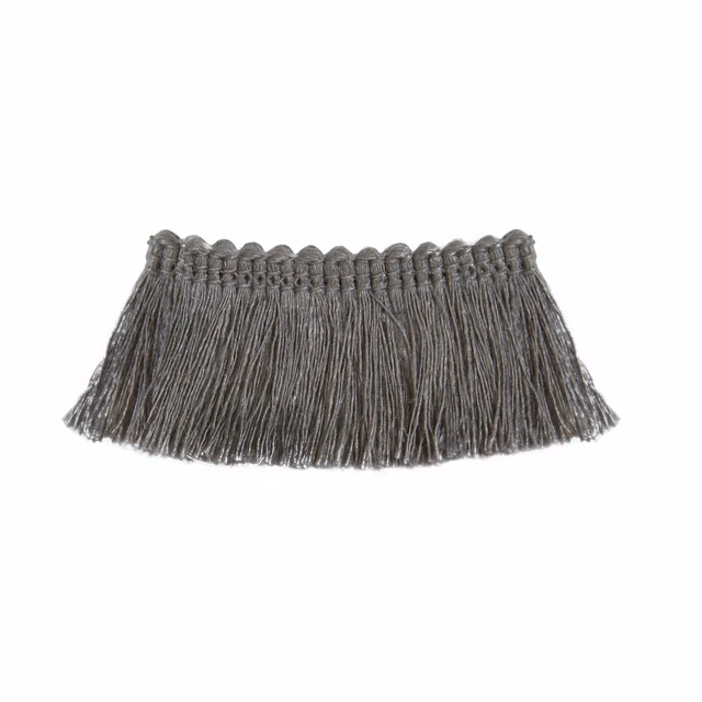 Deep charcoal grey upholstery fringe with long textured tassels and an irregular edge