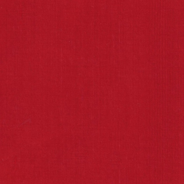 Close view of saturated scarlet-red fabric with fine weave and subtle vertical grain
