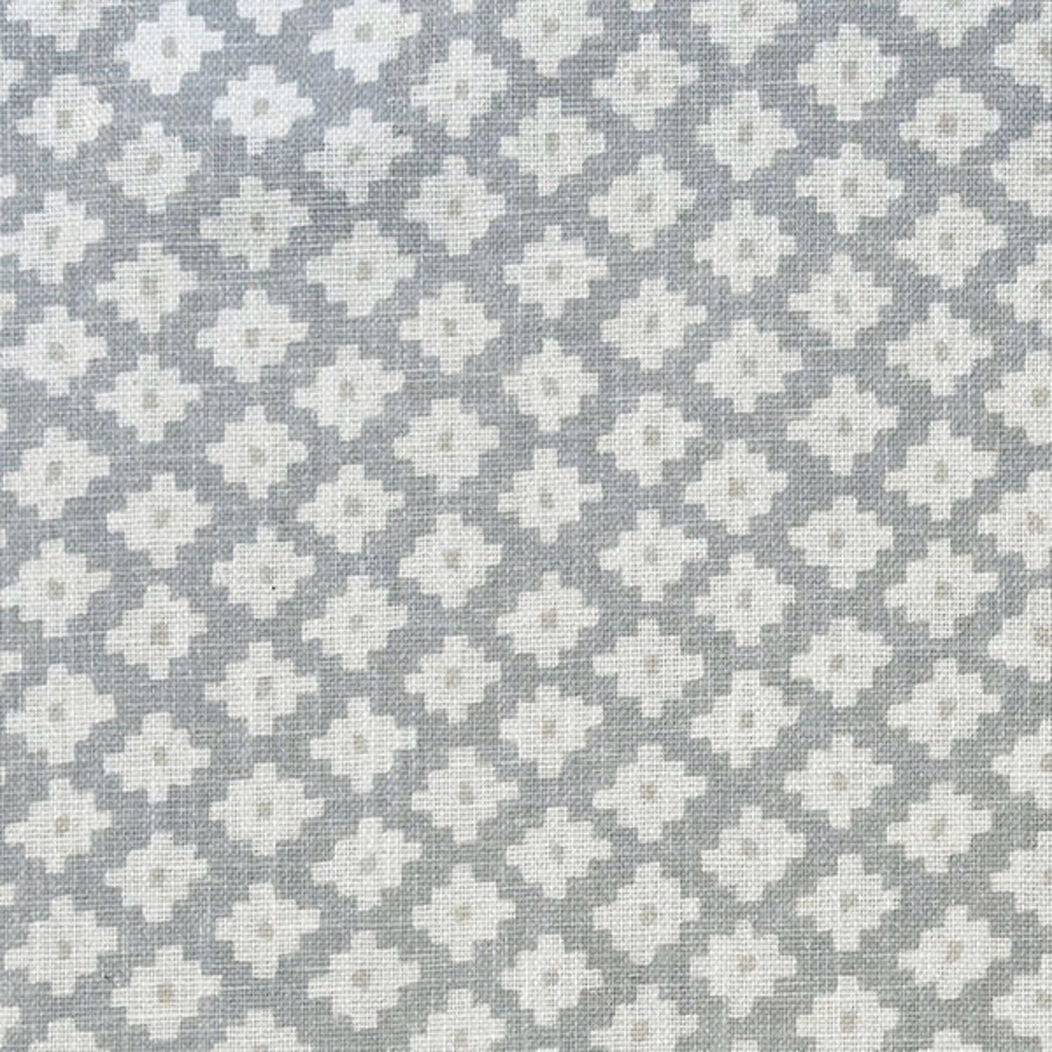 Cool grey woven ground with repeated ivory pixel-like geometric motifs