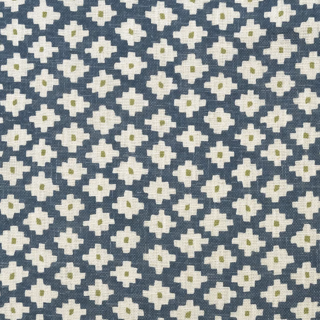 Denim-blue woven fabric with cream geometric flowers and tiny olive centres