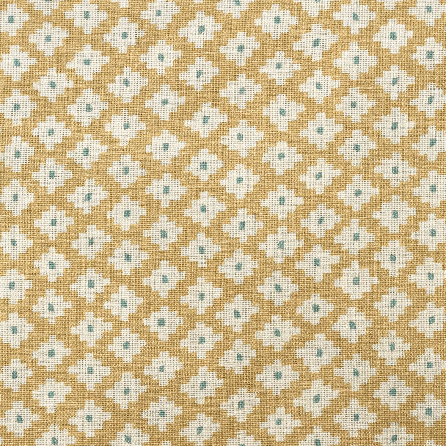 Honey-gold woven fabric with ivory quatrefoil motifs and pale blue-green centres