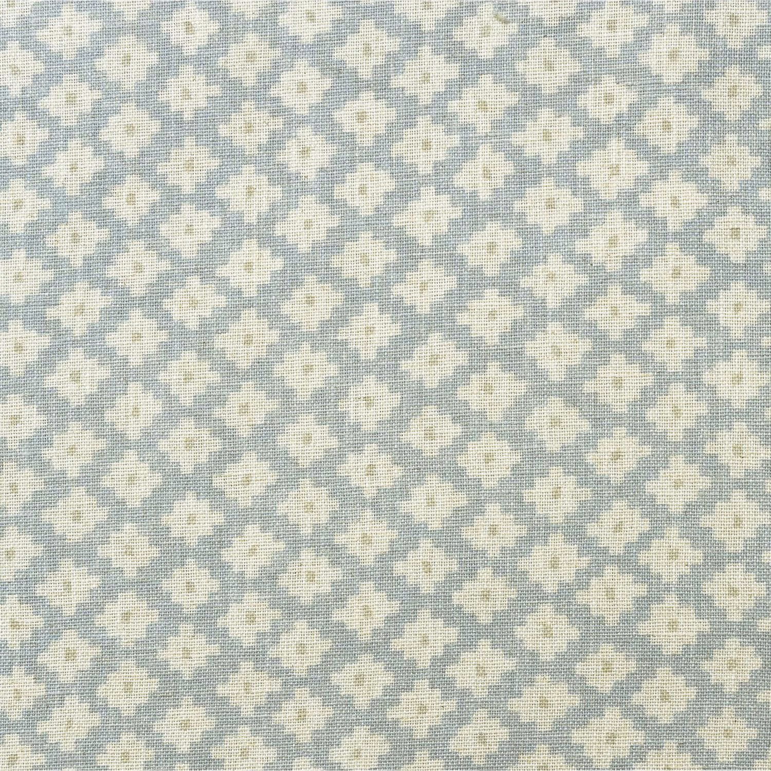 Soft sky-blue woven ground with repeating ivory geometric floral motifs