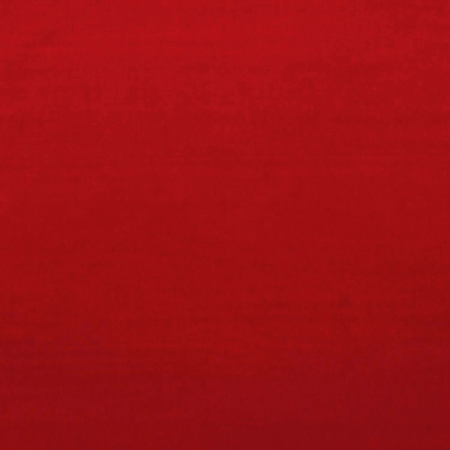 Deep burnt vermillion red velvet with subtle nap shading across the smooth surface