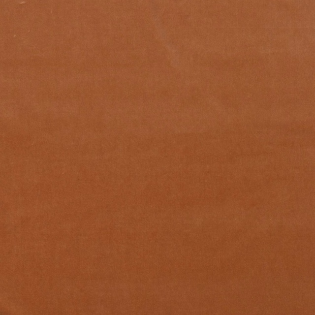 Plain warm rust-terracotta velvet swatch with a softly shifting plush nap