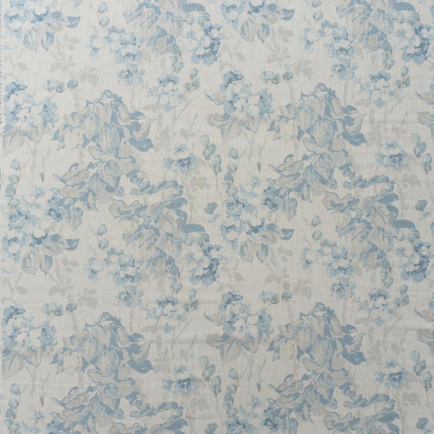 Pale ivory fabric with faded blue botanical bouquets and softly textured floral print