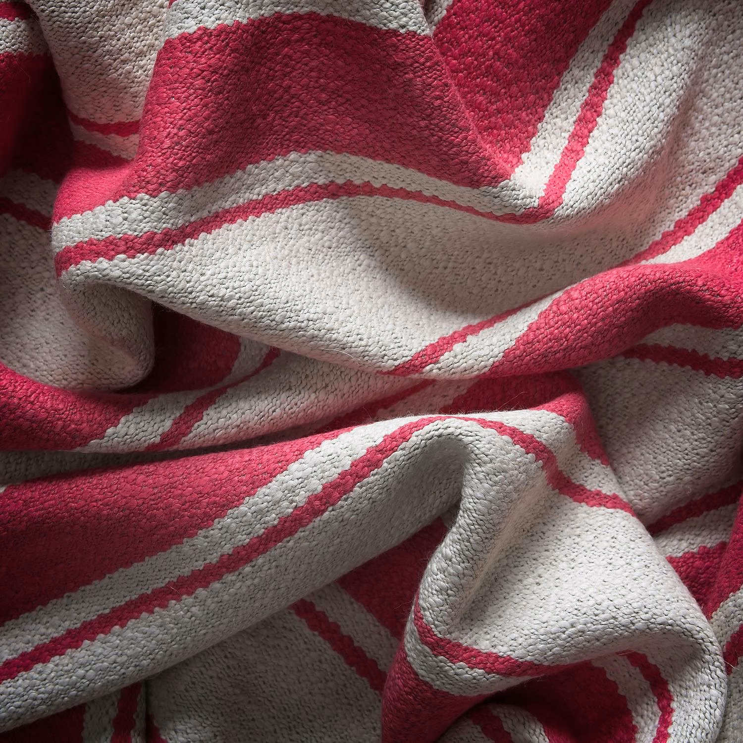 Raspberry and ivory woven stripes gathered into softly sculpted folds