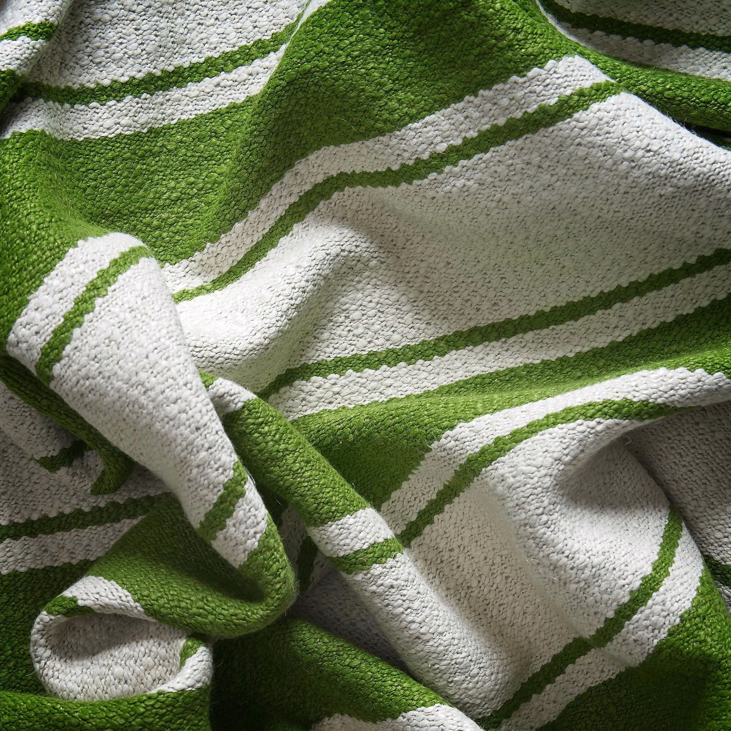 Bright meadow-green and ivory woven stripes gathered into a deeply textured swatch