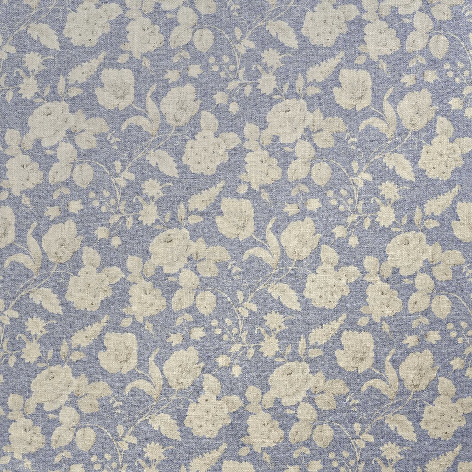 Muted denim-blue woven fabric with a pale cream floral and leafy botanical repeat