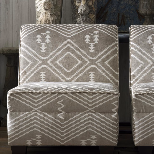 Warm taupe-buff geometric upholstery with white zigzags, diamonds and stepped motifs