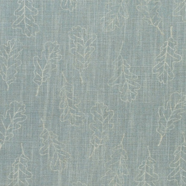 Misty blue-grey woven fabric with pale oak leaf and trailing branch outlines